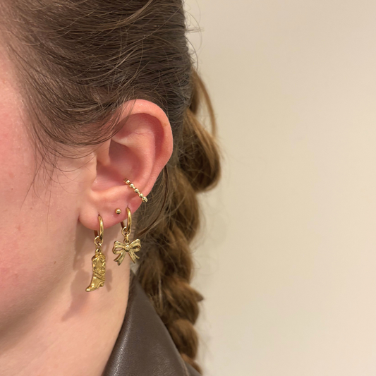 Kleine strikjes oorbellen aanfoto stainless steel goud en zilverkleurig