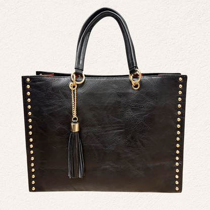 black shopper bag with gold details and tassel