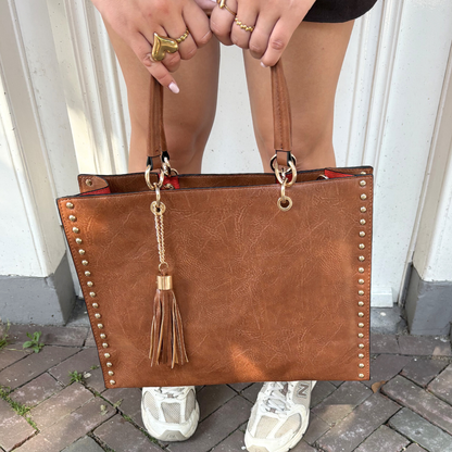 brown shopper with gold details and tassel