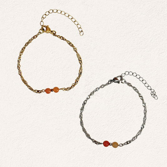 oranje natuursteen met gedraaide schakel armband