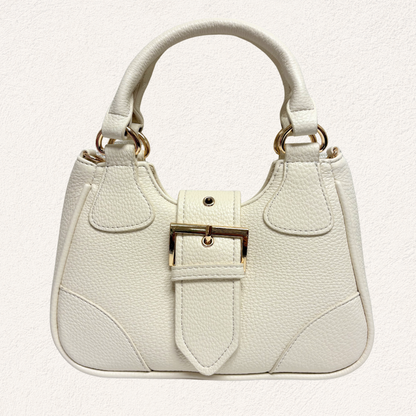 white handbag with gold buckle